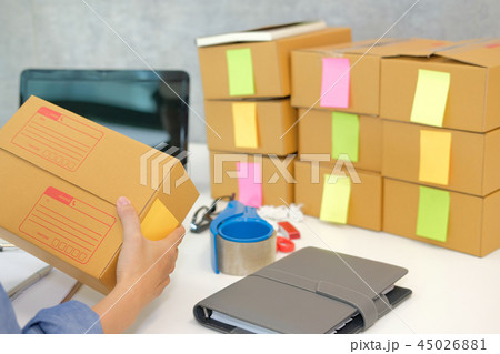 startup business owner hold cardboard box. woman seller prepare parcel box for delivery. Online selling, e-commerce concept 45026881