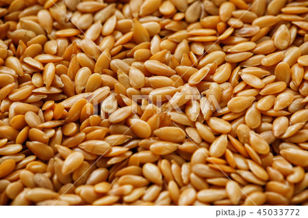 Background texture of white flax seeds. Useful Background texture of white flax seeds. Useful 45033772