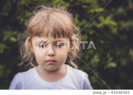 Portrait of a little sad girl Portrait of a little sad girl 45036365