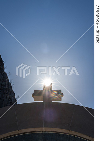 Cross on top of arched gates Cross on top of arched gates 45036627