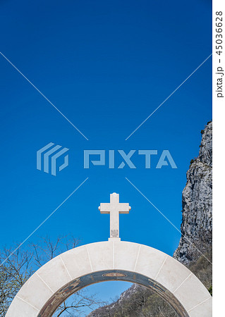 Cross on top of arched gates Cross on top of arched gates 45036628