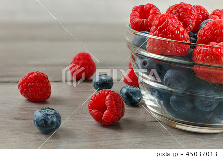 glass bowl of blueberries with raspberries 45037013