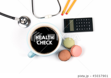 health check concept. coffee mug and macarons biscuits health check concept. coffee mug and macarons biscuits 45037901