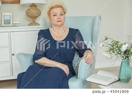 Older woman with book at home, senior 60s Older woman with book at home, senior 60s 45041909