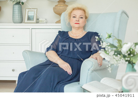 Portrait of beautiful older woman resting at home 45041911