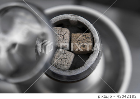 Close-up of a top of hookah with coconut coal. 45042185