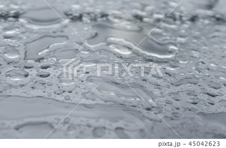 Natural water drops on a glass table after rain. 45042623