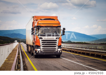 Orange truck on a road 45042930