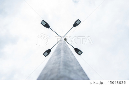 Street light in daytime and blue sky with clouds. 45043026