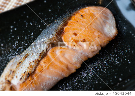 Salmon grilled with salt in Japanese style . Salmon grilled with salt in Japanese style . 45043044
