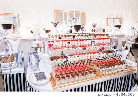 Different kinds of baked sweets on a buffet Different kinds of baked sweets on a buffet 45043509