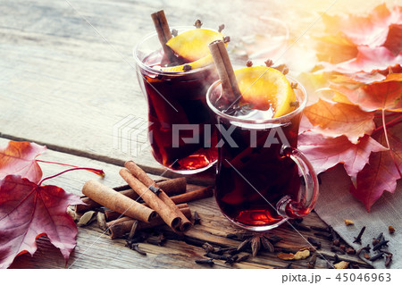 Glass mugs of mulled wine with spices. 45046963