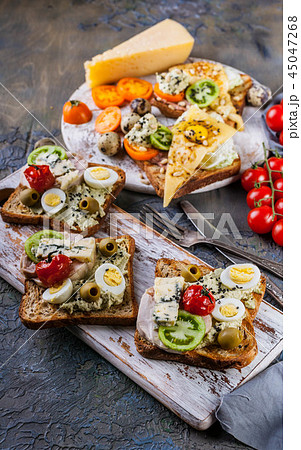 Delicious Toasts with grilled cheese, quail eggs Delicious Toasts with grilled cheese, quail eggs 45047268