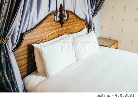 Beautiful comfortable white pillow on bed 45053631
