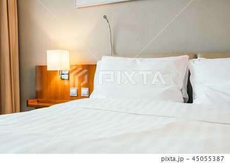 White pillow on bed decoration in bedroom interior 45055387