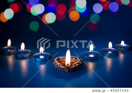 Happy Diwali - Clay Diya lamps lit during Dipavali 45057143