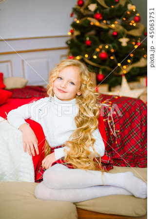 Little girl with  long hair at Christmas morning 45063751