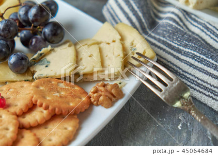 cheese platter on a plate with berries 45064684