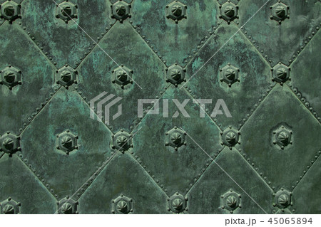 Metal ancient background with green iron decorative figures Metal ancient background with green iron decorative figures 45065894