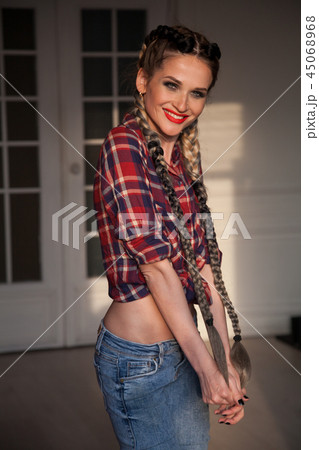 female mechanic in the garage with long braids with female mechanic in the garage with long braids with 45068968