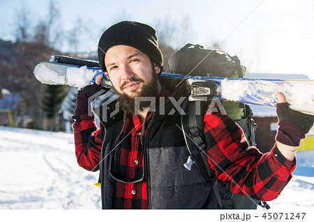 Bearded man with skis on the mountain Bearded man with skis on the mountain 45071247