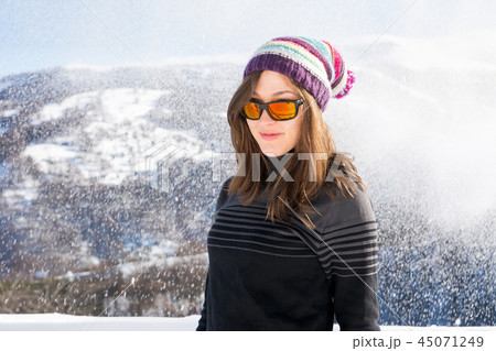 Winter portrait of a girl while snowing 45071249