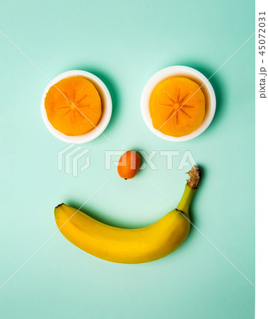Smiley face made of healthy fruits, top view Smiley face made of healthy fruits, top view 45072031