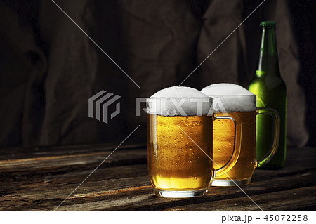 Glass of beer on a dark background Glass of beer on a dark background 45072258