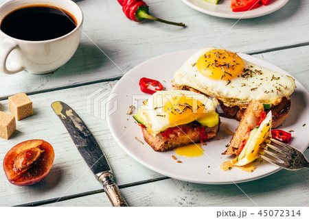 Toasts with vegetables and fried egg 45072314
