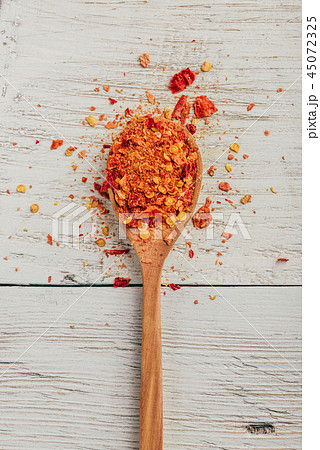 Spoonful of crushed chili pepper Spoonful of crushed chili pepper 45072325