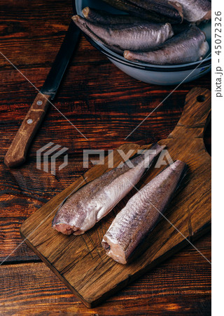 Hake carcasses on cutting board 45072326