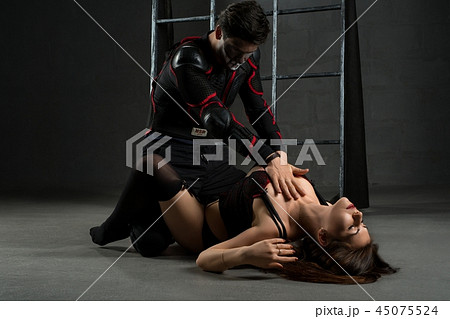 Man and woman acting erotic bdsm perfomance 45075524