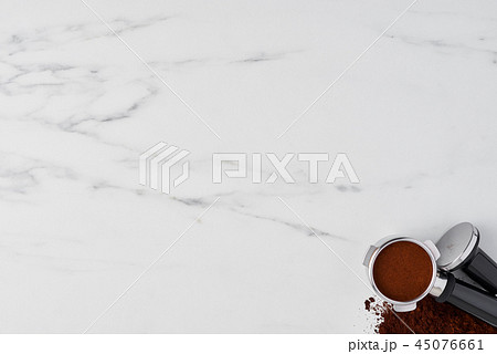 Coffee tamper and portafilter with ground coffee 45076661