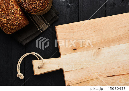 Chopping board and various whole wheat bread 45080453