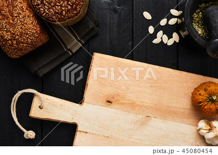 Chopping board and various whole wheat bread Chopping board and various whole wheat bread 45080454