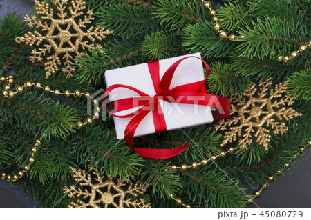 Gift box and christmas tree branches 45080729