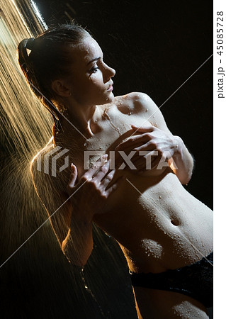 Young brunette topless having shower in the dark Young brunette topless having shower in the dark 45085728
