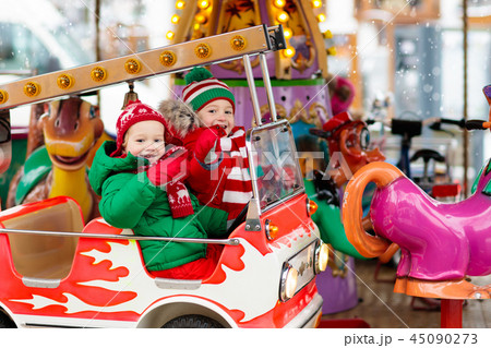 Kids at Christmas fair. Child at Xmas market. Kids at Christmas fair. Child at Xmas market. 45090273