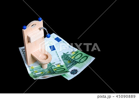 Wooden toy toilet and money on black Wooden toy toilet and money on black 45090889