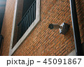 CCTV security camera with brick building  45091867
