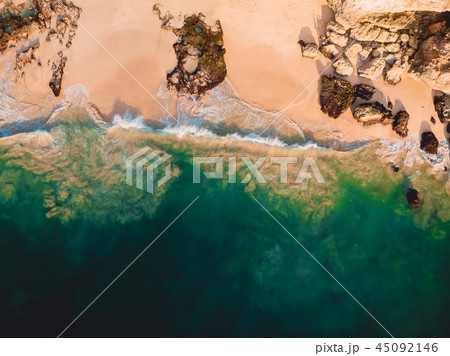 Aerial view of ocean waves at sandy beach. Aerial view of ocean waves at sandy beach. 45092146