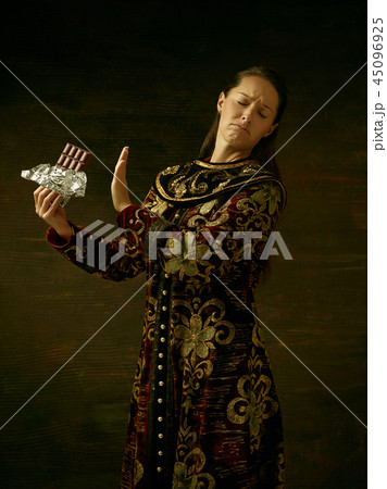 Girl standing in Russian traditional costume. Girl standing in Russian traditional costume. 45096925