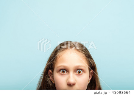 startled surprised shocked girl peeking out bottom 45098664