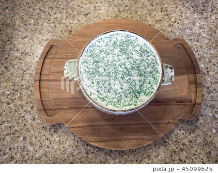 Okroshka on kefir in a clay pot. Top view. 45099625