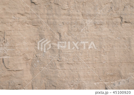 Closeup limestone rock face with weathered strata 45100920