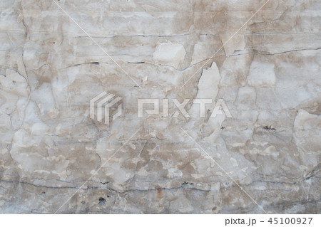 Closeup limestone rock face with weathered strata 45100927