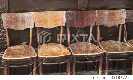 a row of brown old  chairs in a holiday building 45102725