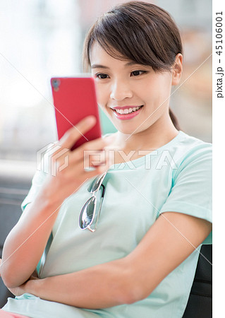 woman use phone happily woman use phone happily 45106001