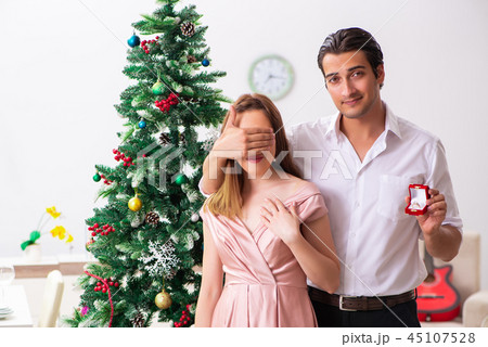 Man making marriage proposal at christmas day 45107528