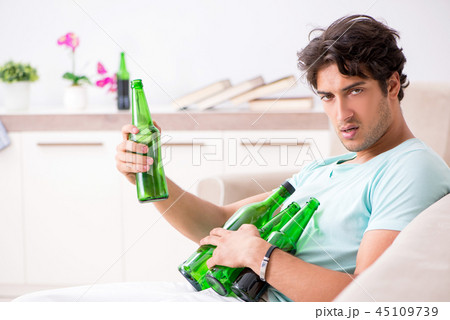 Young drunk handsome man after party at home  45109739